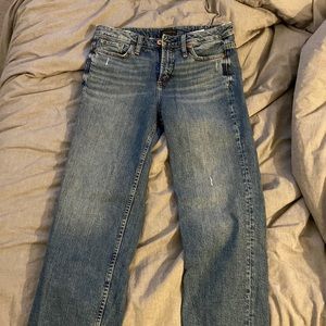 Eyes on wide silver jeans